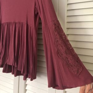 Long, bell bottom sleeved bouse